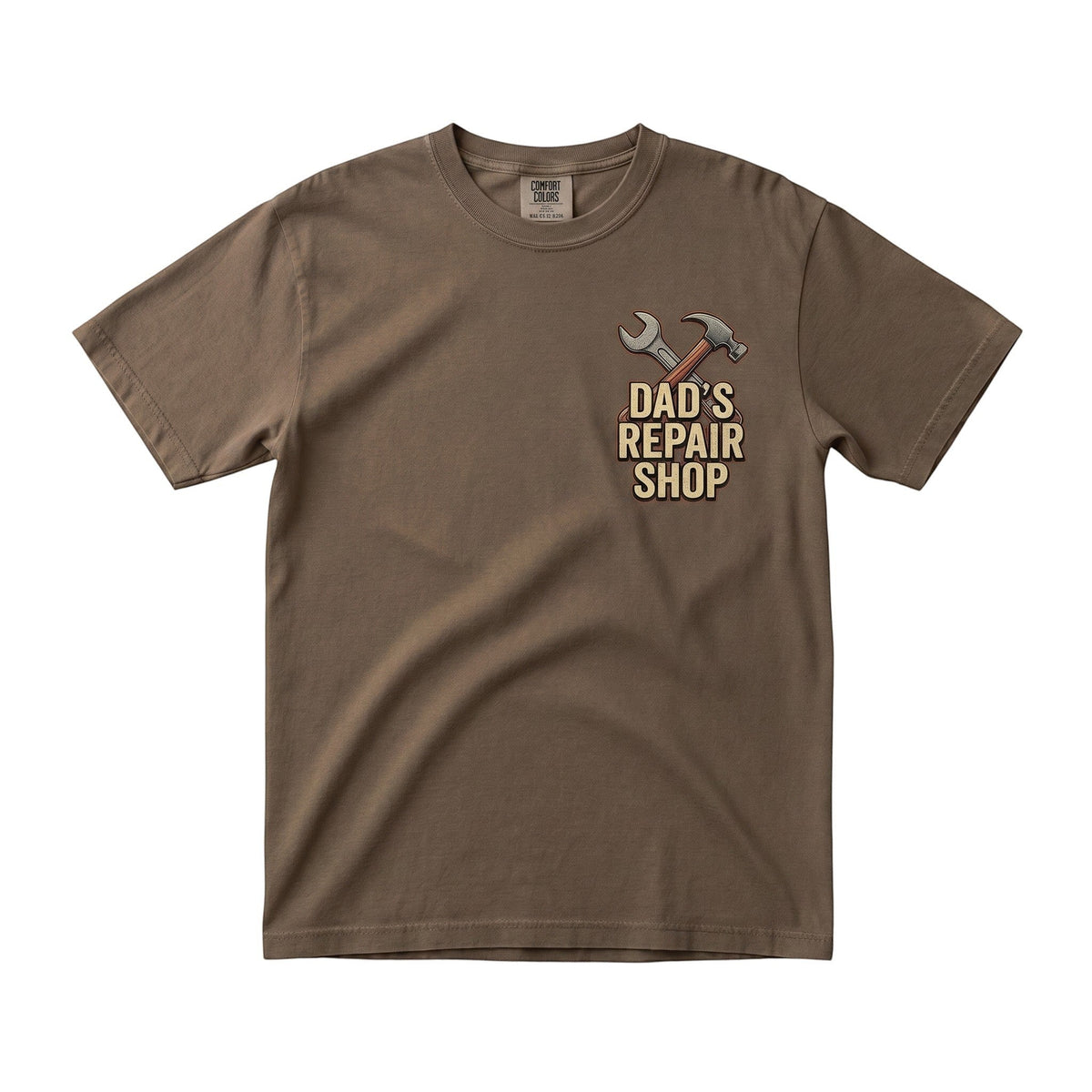 TrendyShift.Com brown short sleeve crew neck t-shirt with Dad's Repair Shop hammer and wrench graphic on the chest