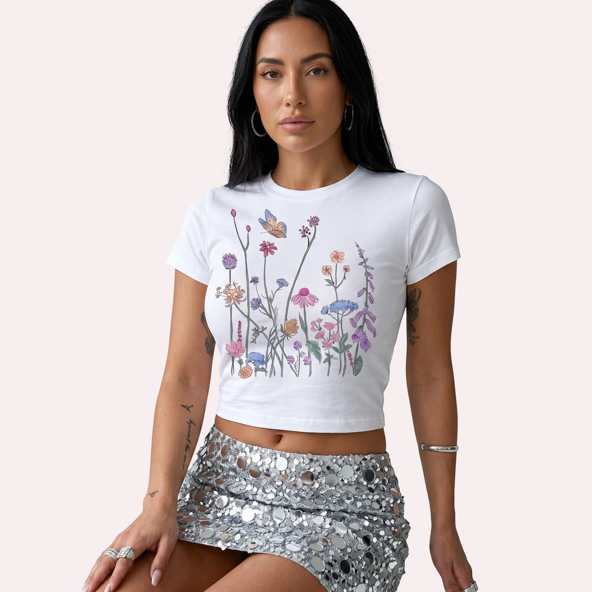 TrendyShift.Com white micro rib crop tee featuring a colorful wildflower and butterfly graphic print.