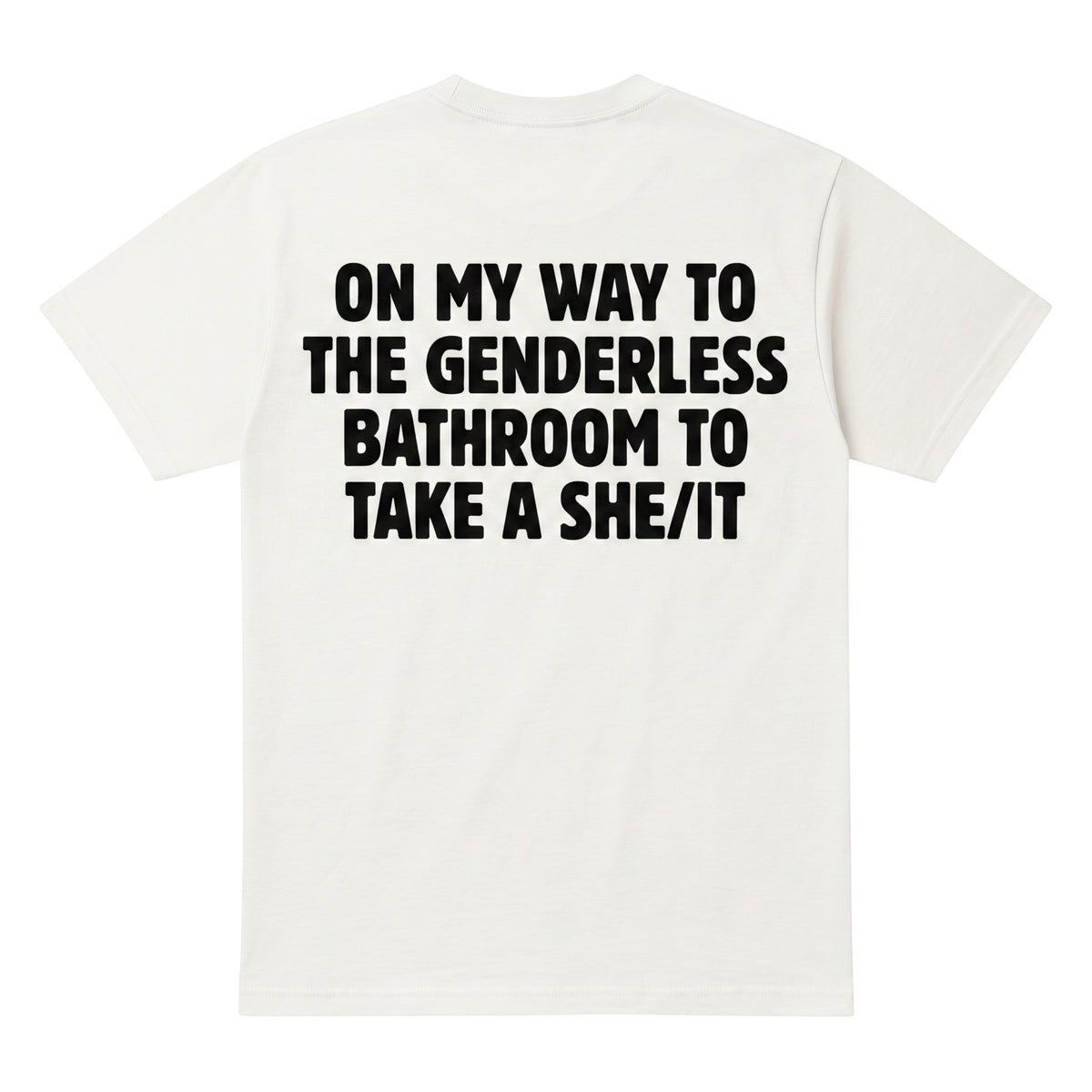 TrendyShift.Com white cotton t-shirt with black text on the back reading On my way to the genderless bathroom to take a she/it.